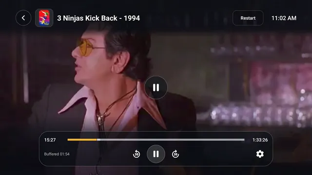 TV screen: a film playing full screen with the playback controls and progress bar showing.